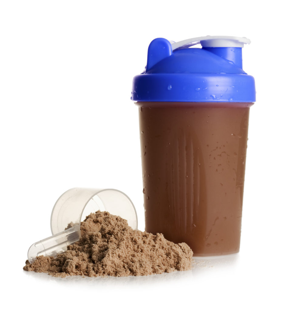 Shaker and Cup of Protein Powder Isolated on White Stock Image